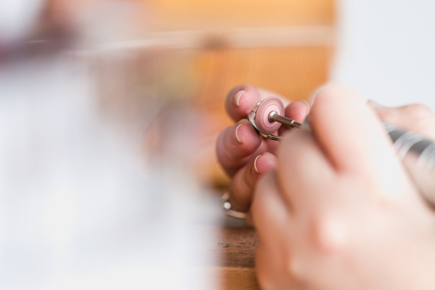 image of someone buffing a piece of jewellery